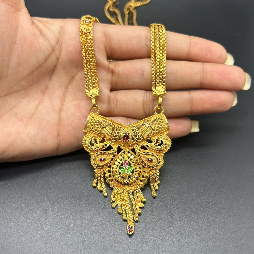 Gold-plated black beaded long mangalsutra, has a stylized centerpiece with textured details